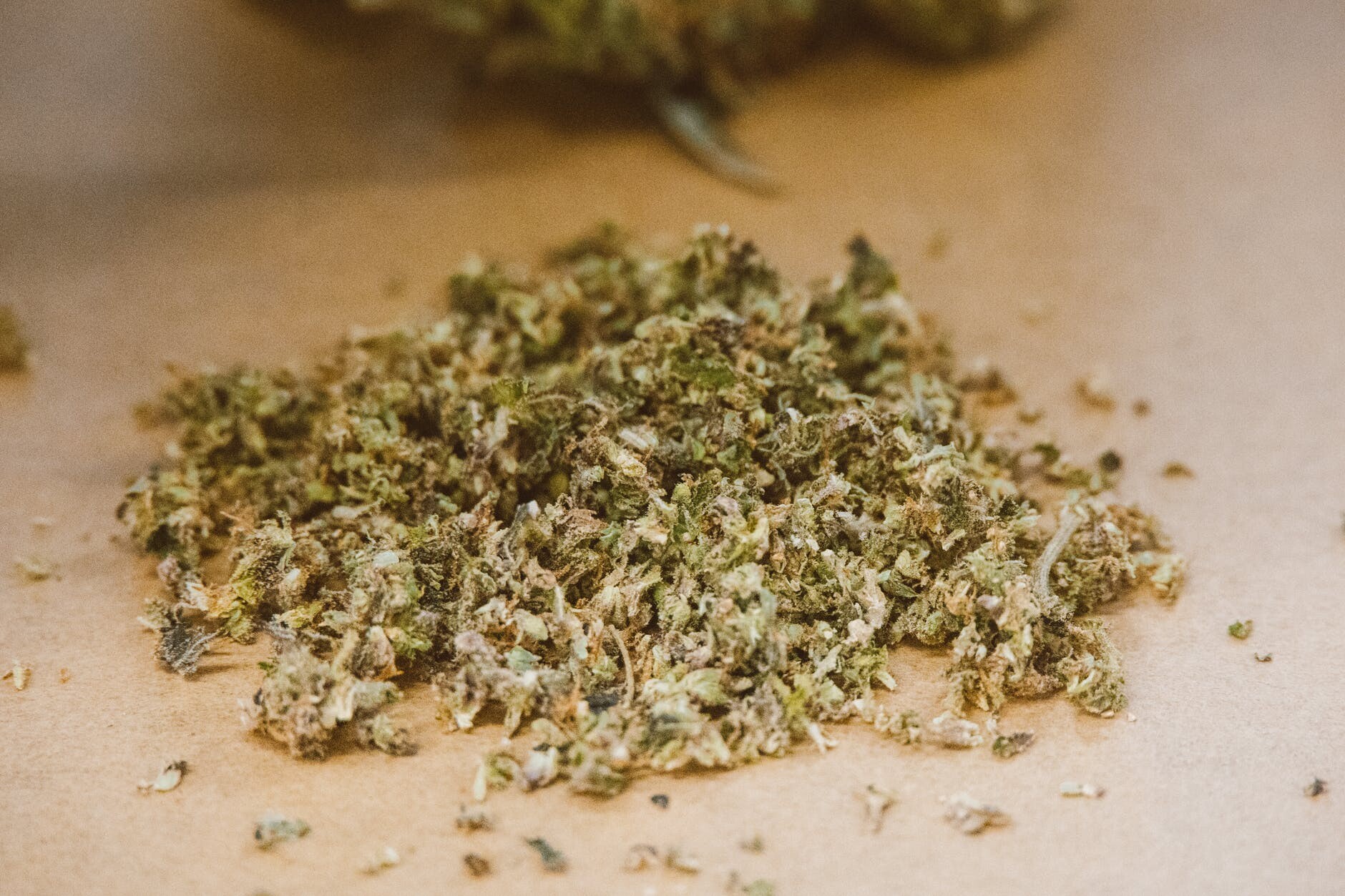 green kush on brown surface